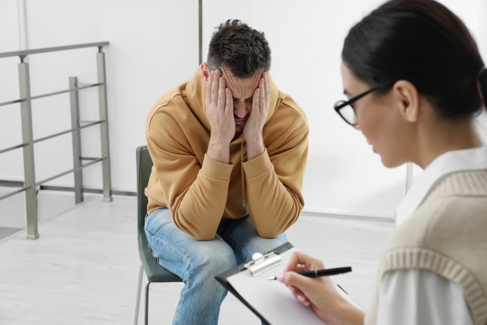 Psychotherapist working with a substance use disorder man under the Marchman Act