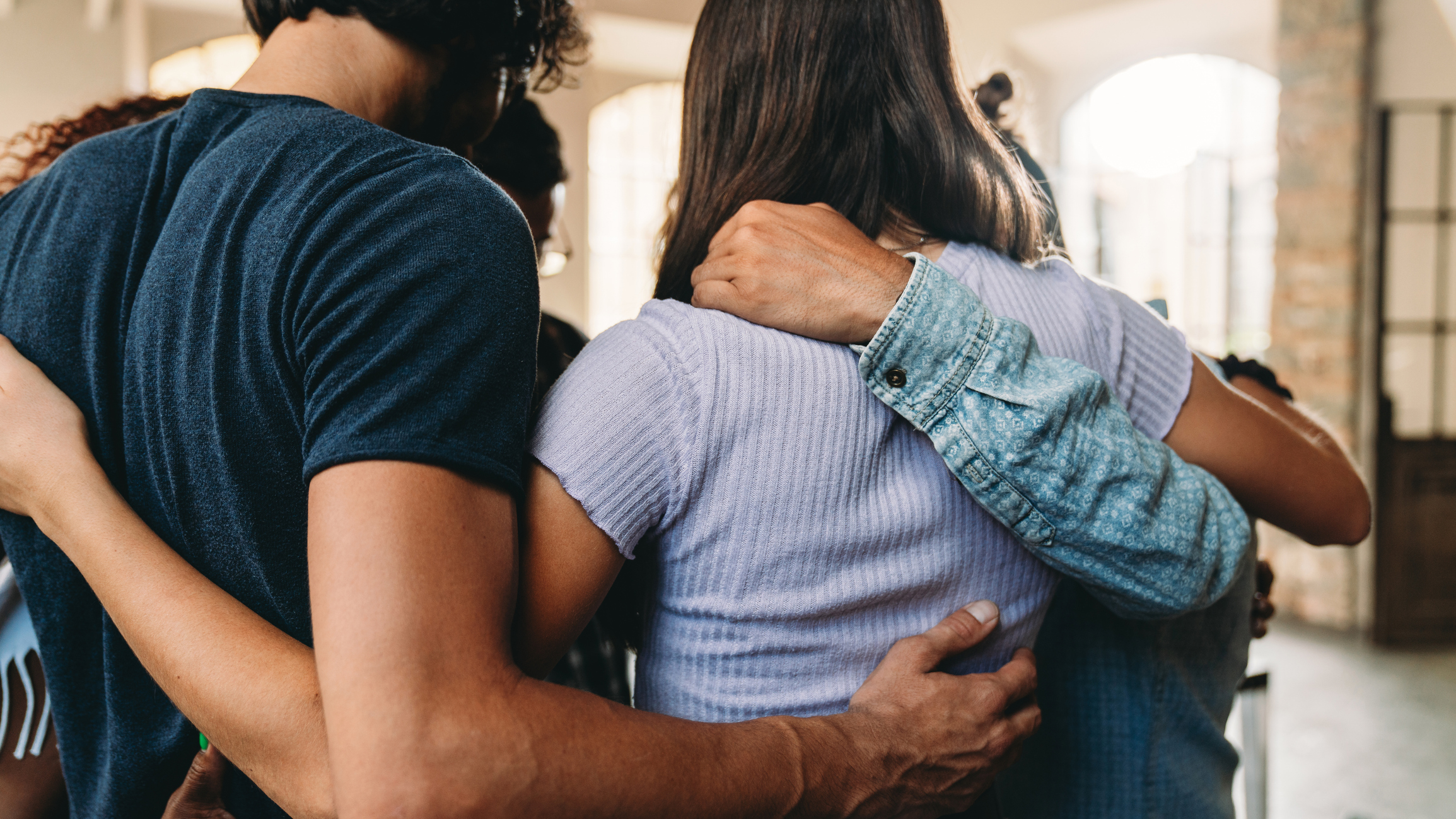 People embracing together
