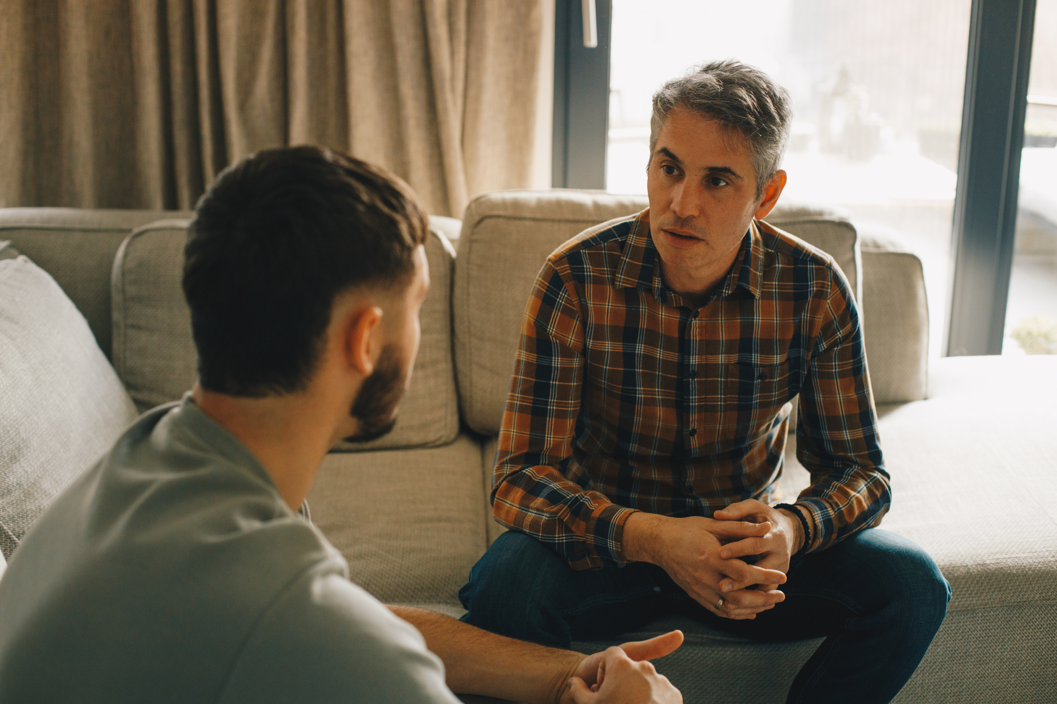 father and son having serious conversation