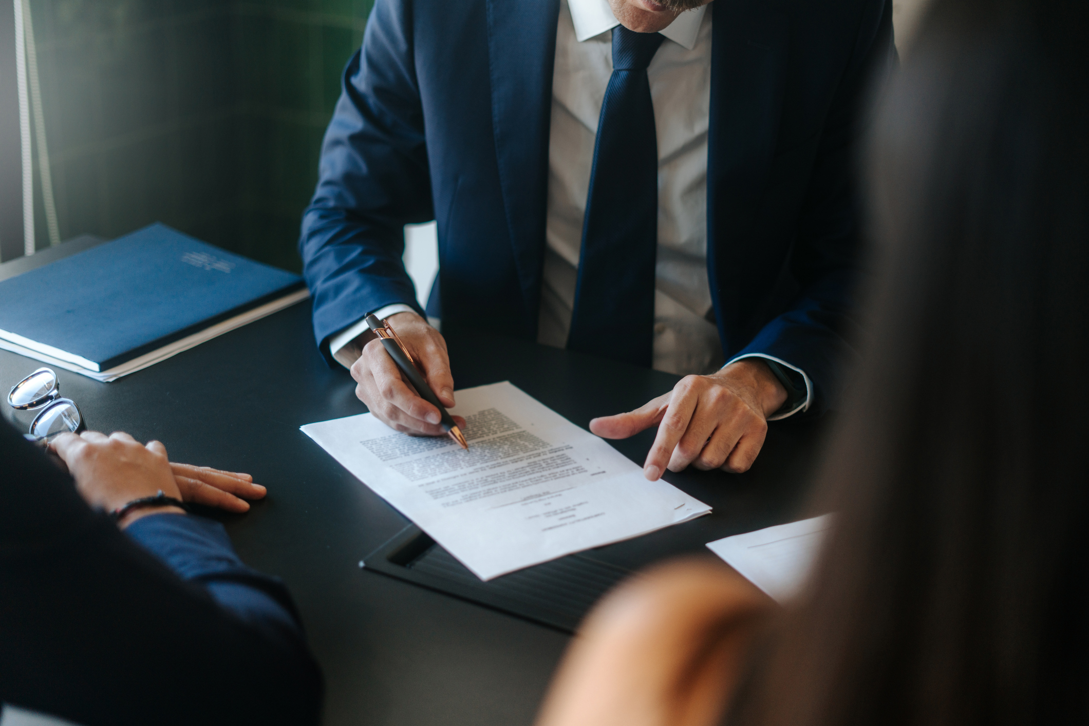 Attorney discussing legal work with clients